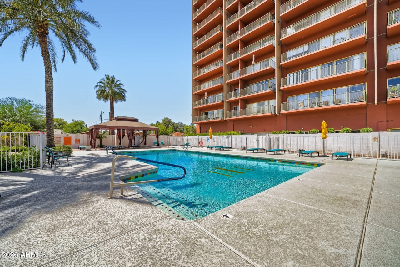 Tiered balconies of Landmark Towers above the pool deck