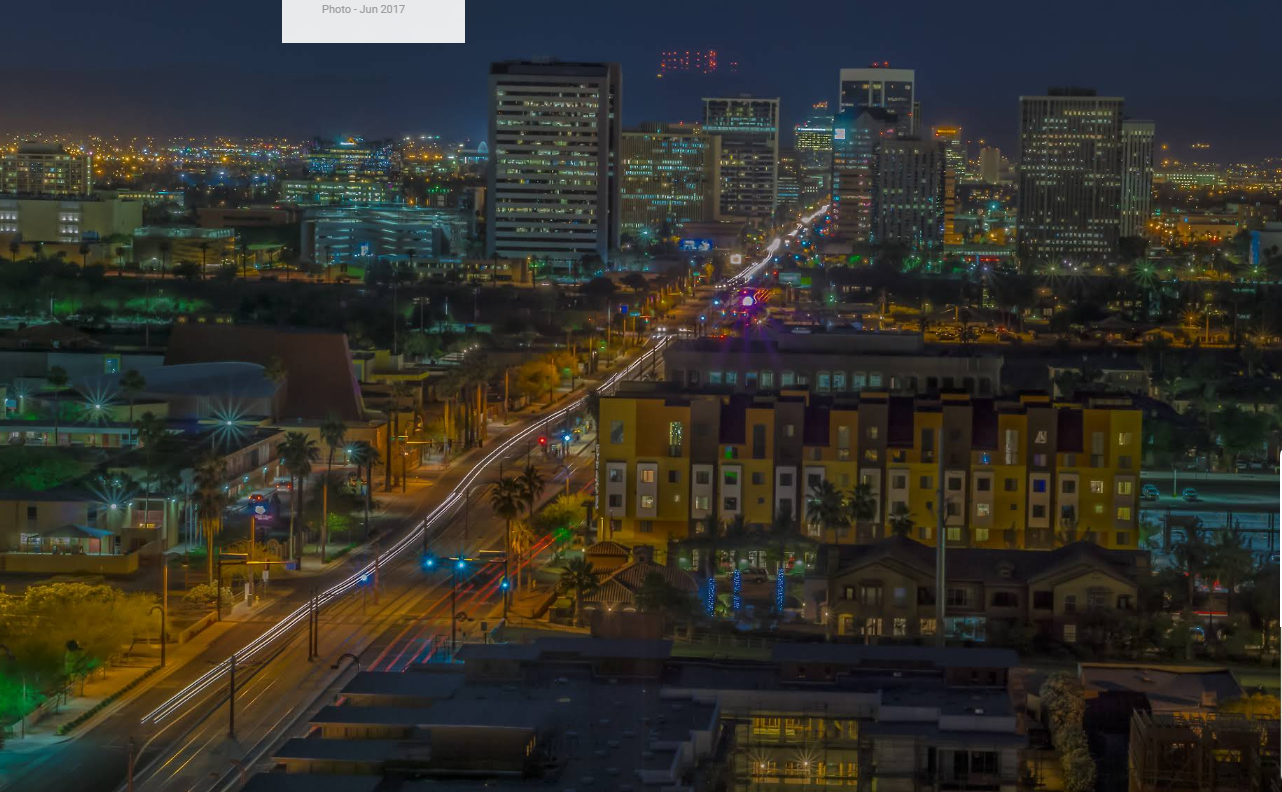 Downtown Phoenix skyline and the Central Avenue light rail at night